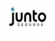 The logo for Junto Seguros. The word "Junto" is in a black, rounded, sans-serif font, with a small icon of overlapping blue and purple circles above the 'j'. The word "Seguros" is in a smaller, black, all-caps sans-serif font centered below the 'unto'.