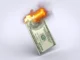 Burning US dollar bill symbolizing inflation eroding purchasing power and causing financial stress.